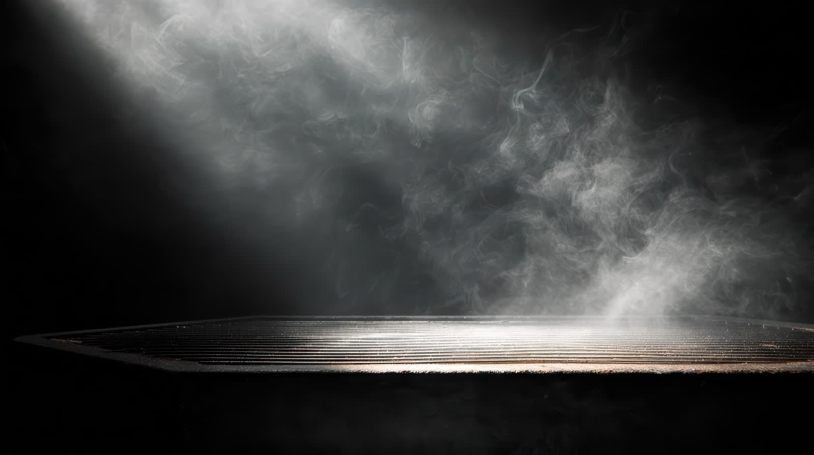 Dramatic spotlight on smoky stage